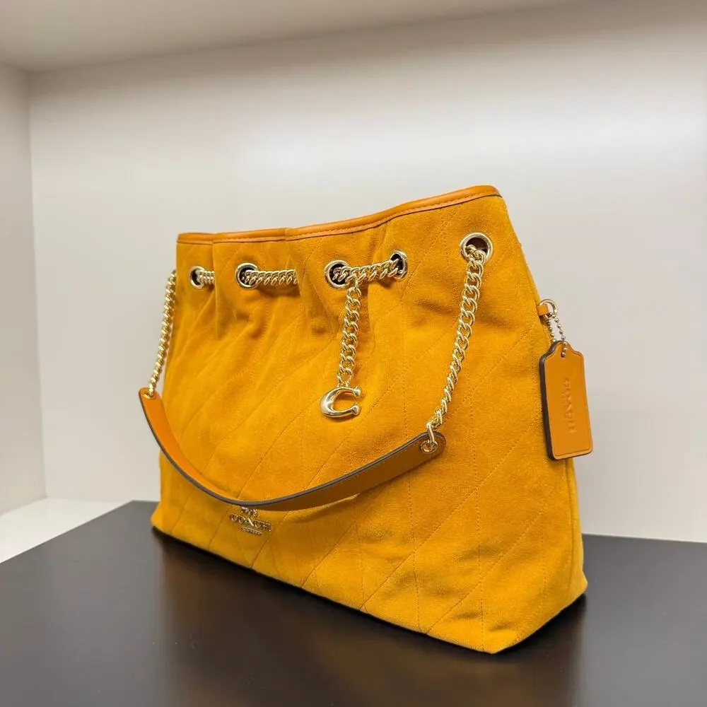 NEW‼️Coach Evelyn Shoulder Bag With Quilting And Charm CET33 suede/Gold/Marigold